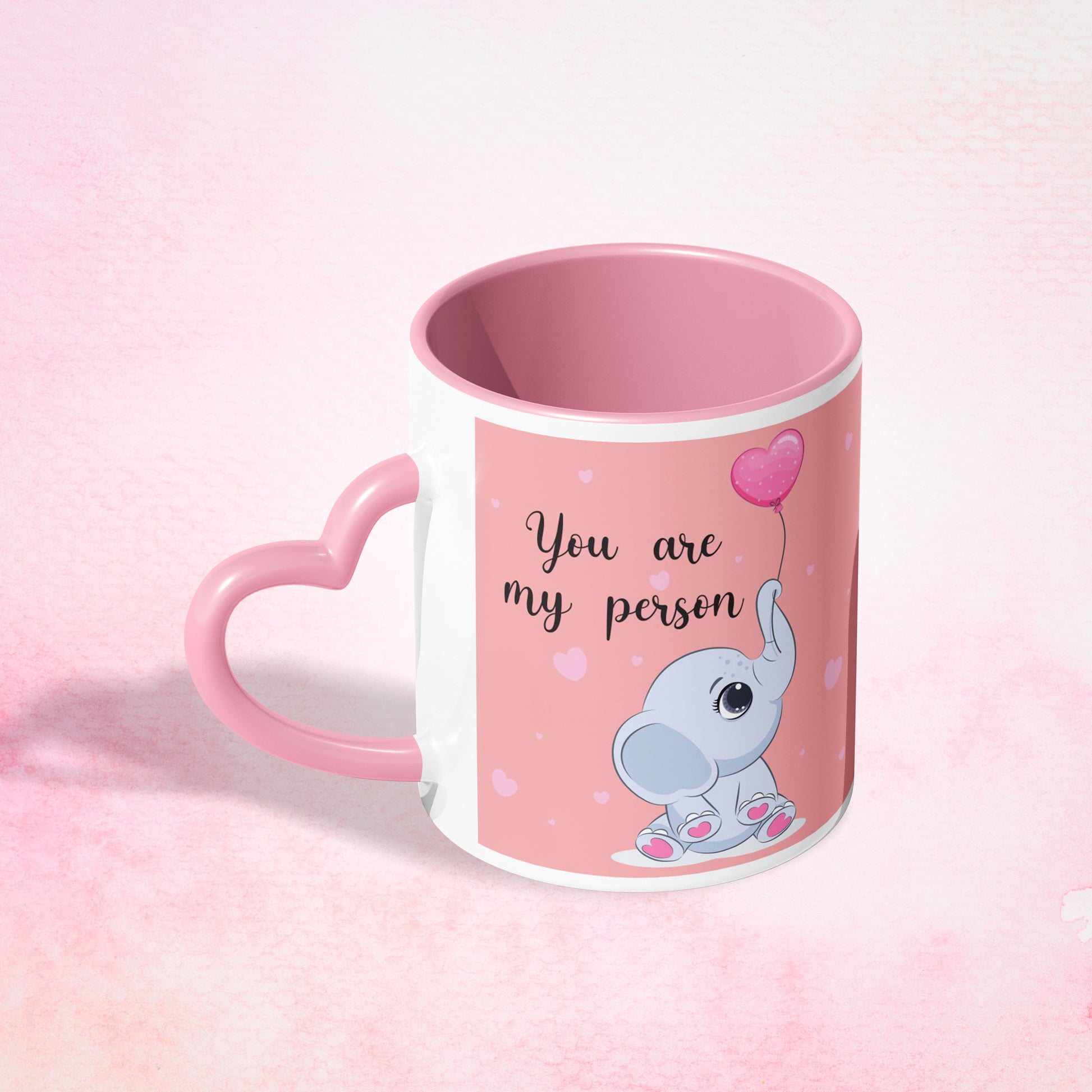 b6ced7b1-02f6-4e33-a962-08b243fdc750/Pink-Heart-Shaped-Handle-Mug-Mockup-4_n_0007_my_person.jpg