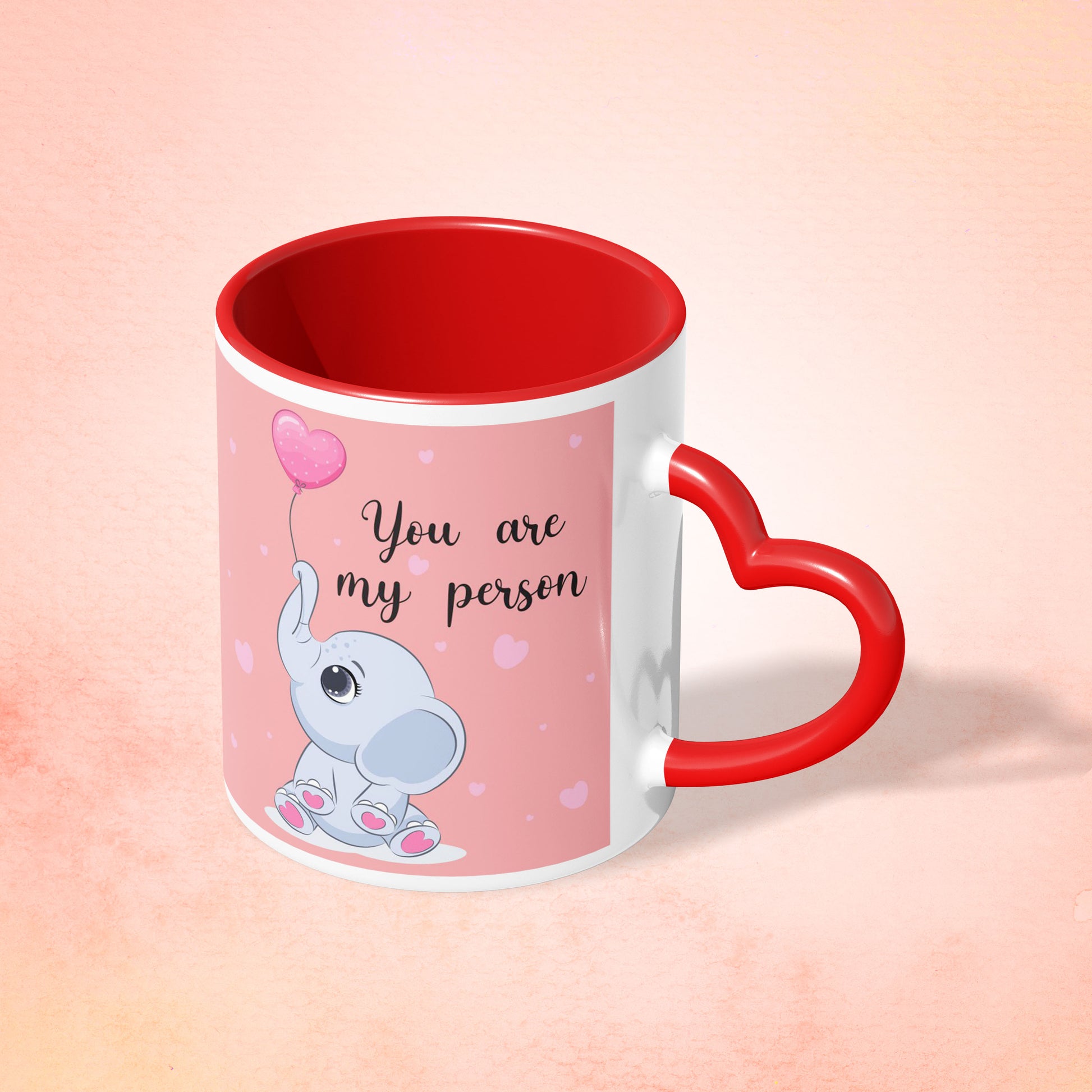 e99c504f-e37f-4aa6-8d0a-edc3d08cf5e5/Red-Heart-Shaped-Handle-Mug-Mockup-1_n_0007_my_person.jpg